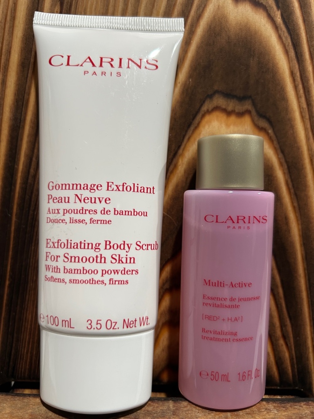 Clarins White Exfoliating Body Scrub & Pink Multi-Active Essence
